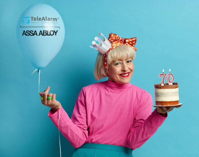 Happy Grandmother Celebrating Birthday. Lady With Cake And Inflated Balloon