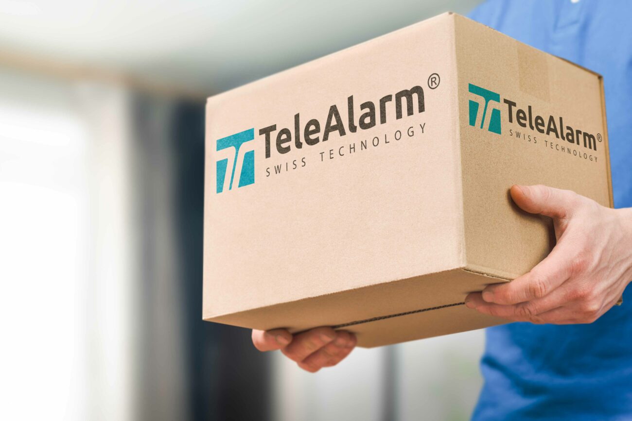 Man,Holding,A,Cardboard,Box,In,His,Hands,Close-up